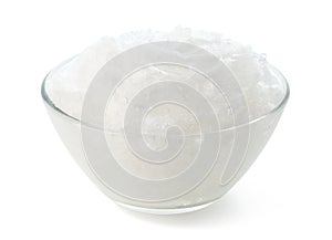 Glass bowl of coconut oil on white background