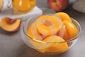 Glass bowl with conserved peach halves
