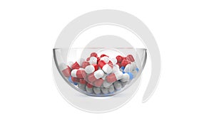 Glass bowl filled with red and blue pills - isolated on white background