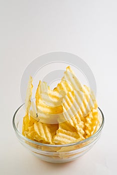 glass bowl filled with ribbed fries