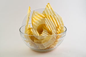 glass bowl filled with ribbed fries