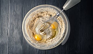 Glass bowl with flour and egg yolks