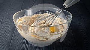 Glass bowl with flour and egg yolks