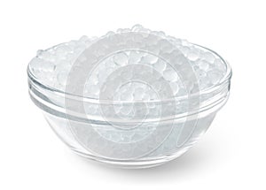 Glass bowl full of silica gel granules photo