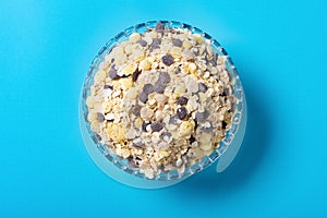 Glass bowl of mixed oatmeal and maize and dark grains and red jujube and coix seed