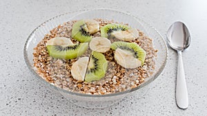 A glass bowl of oatmeal porridge. Healthy breakfast.