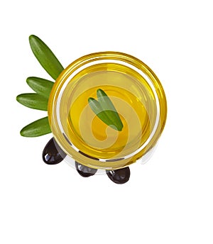 Glass bowl olive oil isolated liquid nutrition on a white backgroundGlass bowl with olive oil isolated on a white background