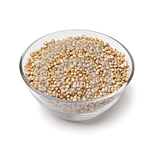 Glass bowl with puffed quinoa close up on white background