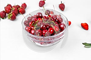 Glass bowl with ripe red cherries. Healthy eating. Fruit is a source of vitamins