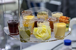 glass bowls with different sauces and jams