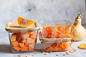 Glass boxes with fresh raw orange vegetables. Finaly shredded pumpkin and big pieces. Healthy Meal Prep, recipe preparation photos photo