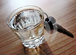 Glass of brandy with car key