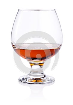 Glass of brandy on white background