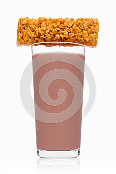 Glass of breakfast chocolate milk with cereal bar