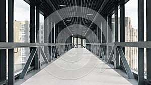 glass bridge, urban connector, metal structure.