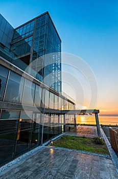 Glass building exterior at sunset