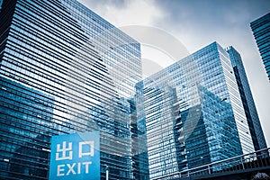 Glass building with garage exit traffic sign