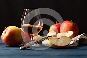 Glass of Calvados Brandy and red apples