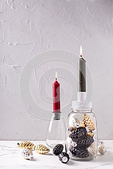 Glass candleholders with gold, black, silver decorative cones