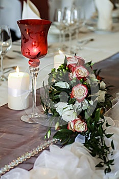 Glass, candles and flowers