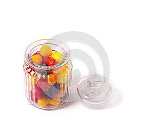 Glass candy jar filled with colorful candies.