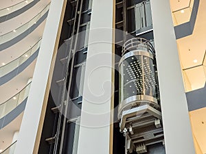 glass capsule elevator ,lift at luxury hotel or building.modern glass elevator to the upper floors, high building