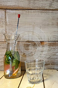 Glass carafe with a natural drink made of water, mint and grapefruit