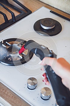 Glass ceramic stove cleaning with a steam cleaner, house disinfe