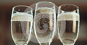 Glass, champagne and alcohol, bubbles and toast for new year, party and celebration against blurred background. Drink