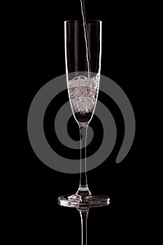 Glass of champagne on a black background