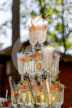 Glass of champagne for event party or wedding ceremony. Pyramid of glasses of champagne