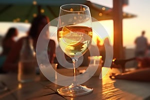 glass of champagne in hand on evening pink sunset summer beach restaurant beach , romantic couple silhouette