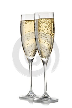 A glass of champagne, isolated on a white background.