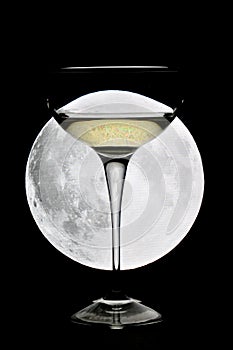 Glass of champagne under a full moon