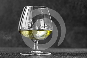 Glass of Chartreuse on the rocks