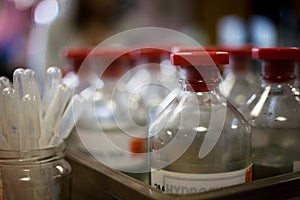 Glass chemical bottles and pipettes.