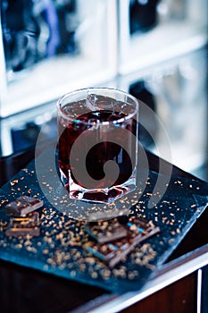 Glass of cherry juice with chocolate pieces