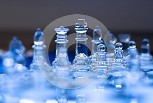 Glass chess game, king with queen, blue tones