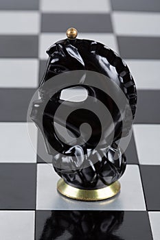 Glass chess pieces on a chessboard