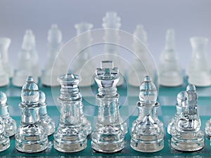 Glass Chess Pieces on a Frosted Glass