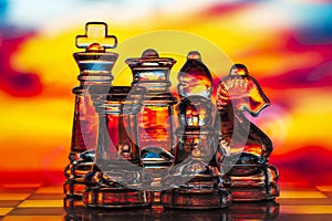Glass chess pieces, king, queen, knight, bishop, rook and pawn. Macro