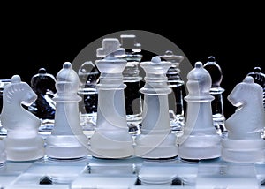 Glass chess pieces, lined up