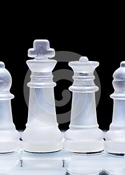 Glass chess pieces, lined up