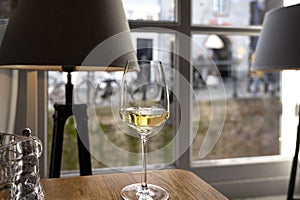 Glass of Chilean Chardonnay Viognier white wine served in cosy Dutch restaurant