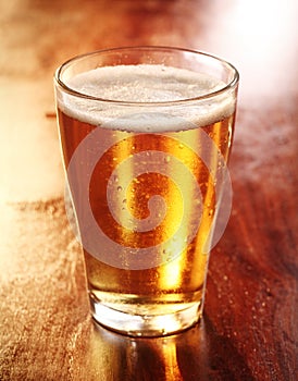 Glass of chilled golden lager or beer