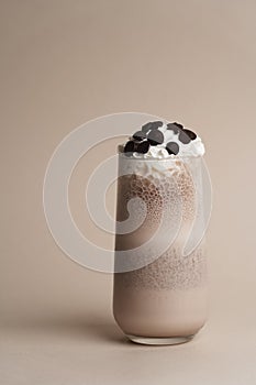 Glass of chocolate milkshake with whipped cream