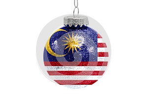 Glass Christmas ball toy isolated on white background with the flag of Malasia photo
