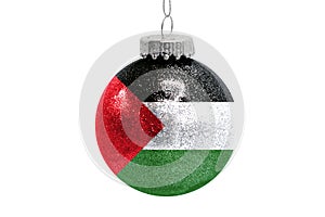 Glass Christmas ball toy isolated on white background with the flag of Palestine