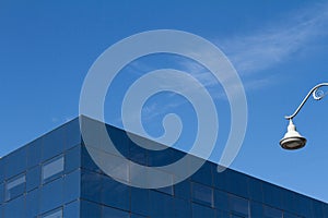 Glass city office building detail with blue sky