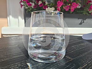 Glass of clean cold water on table in a cafe